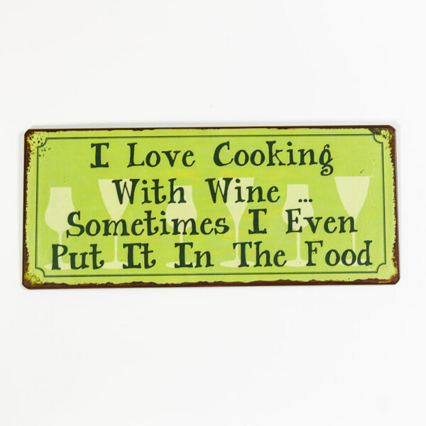 Skylt ”I love cooking with wine, sometimes I even put it the food”
