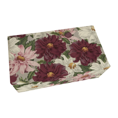 En rektangulär tvålförpackning i vintagestil med röda, rosa o vita dahlior på omslaget.