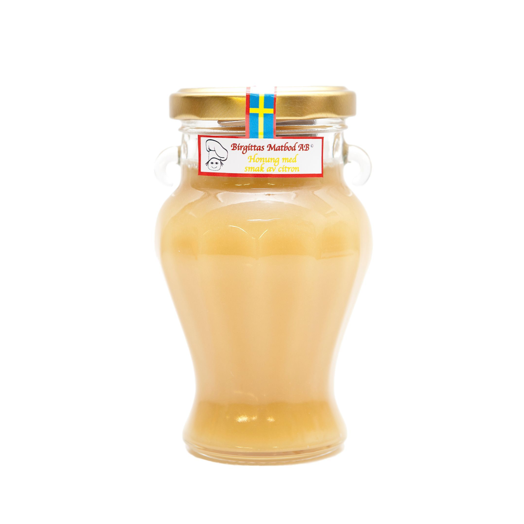 En burk med Honung som smaksatts för citron.